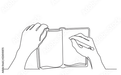 continuous line drawing of hand writing notes in workbook