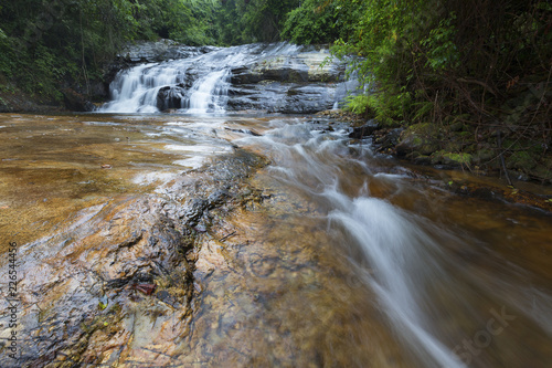 River flowing over rocks and the Debengeni Waterfall photo