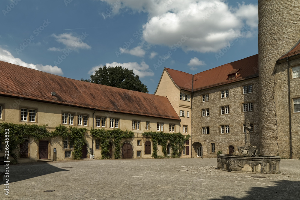 Weikersheim, Germany – castle courtyard with a fountain. Weikersheim, Germany – castle courtyard with a fountain.