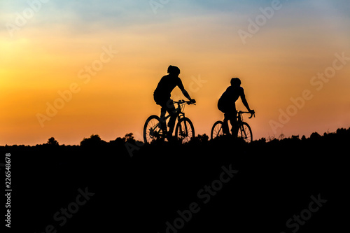 Silhouette of cyclist on the background of beautiful sunset