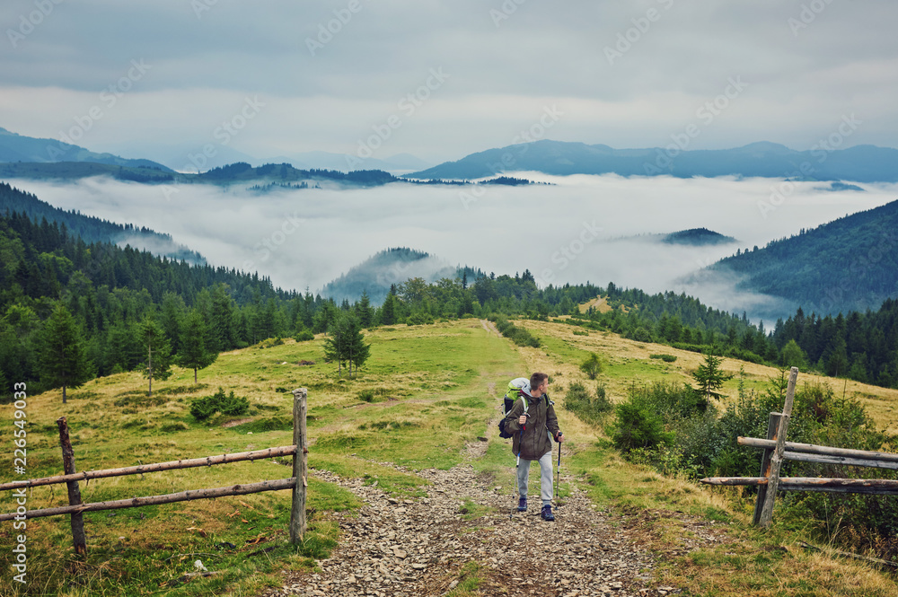 Obraz premium tourist on the road in the mountains