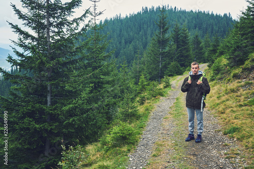 tourist on the road in the mountains