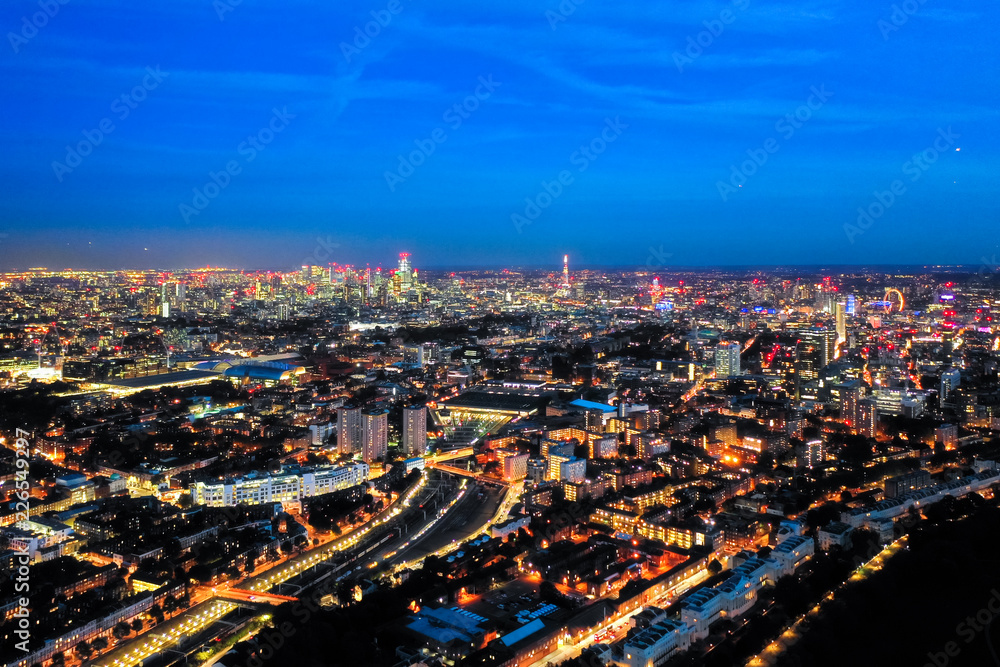 Aerial view night cityscape of London with urban architectures. Icons of the London skyline feat. residential areas such as Euston, Fitzrovia, Marylebone with Central Famous Buildings in England, UK