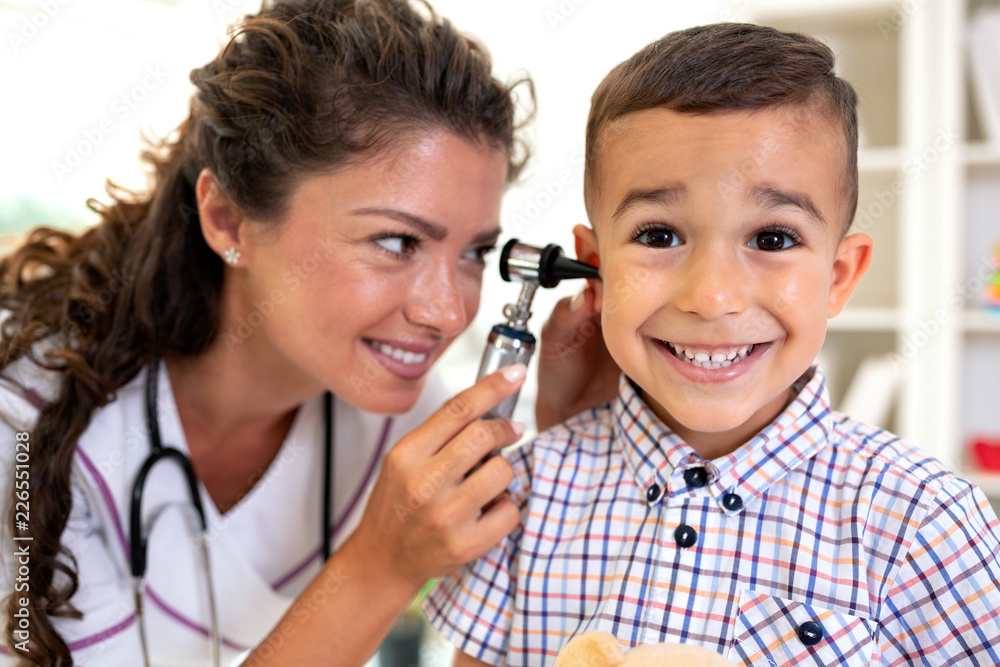 Otoscope ear examination performed by a young doctor Otoscope ear examination performed by a young doctor