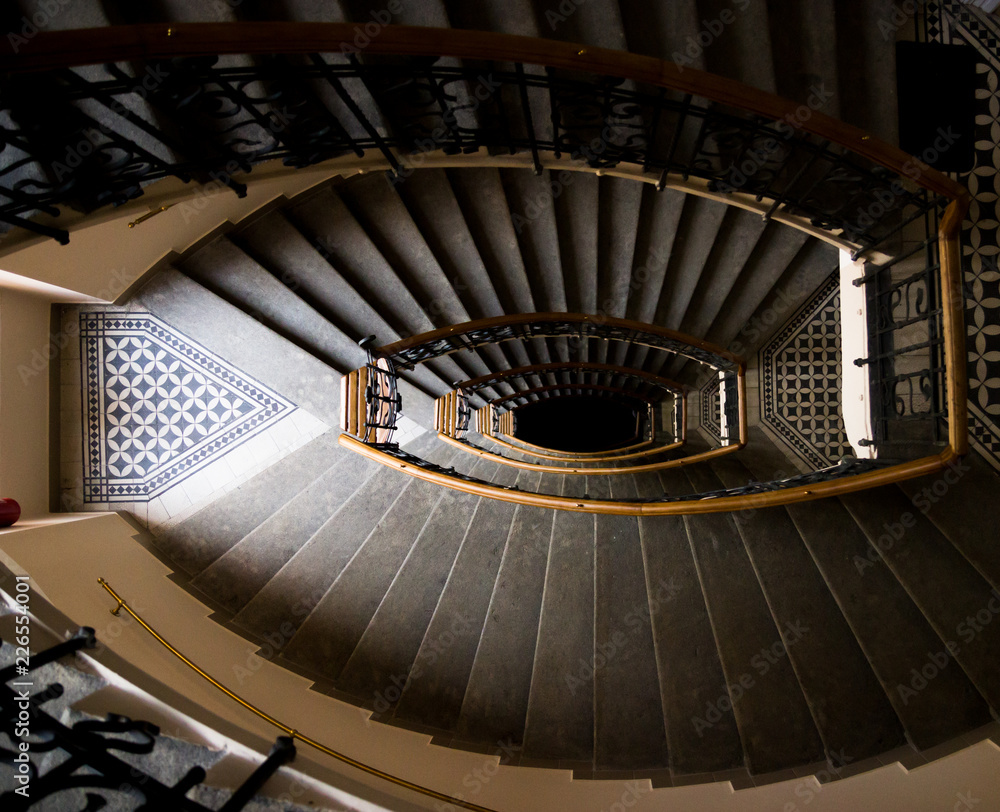 Obraz premium Geometry lines in retro ladder stairs in a house with a dark light