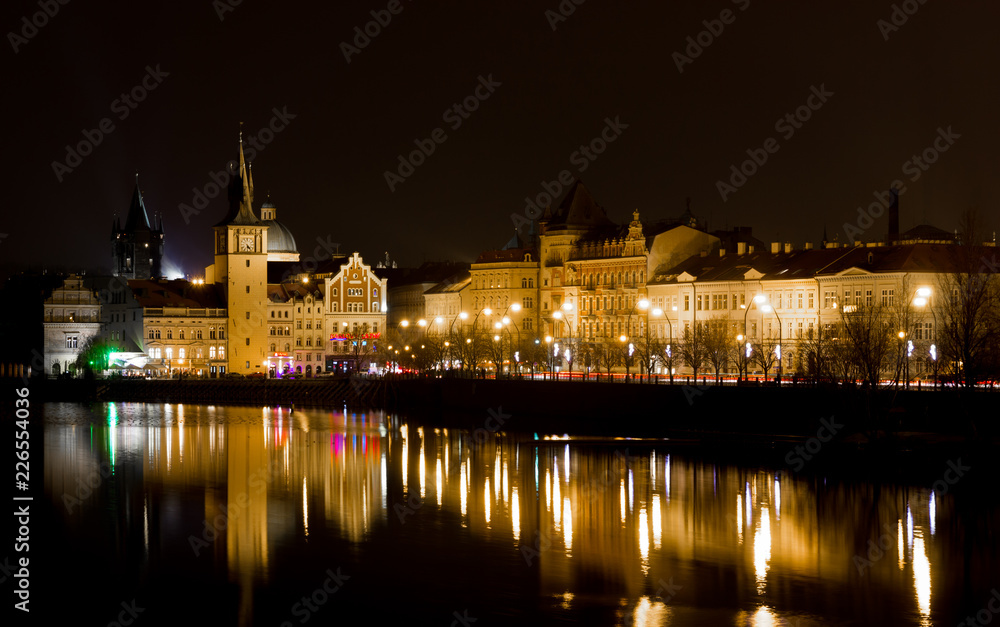 10 December 2017. Prague, Czech. Night Prague city with river and buildings lighted