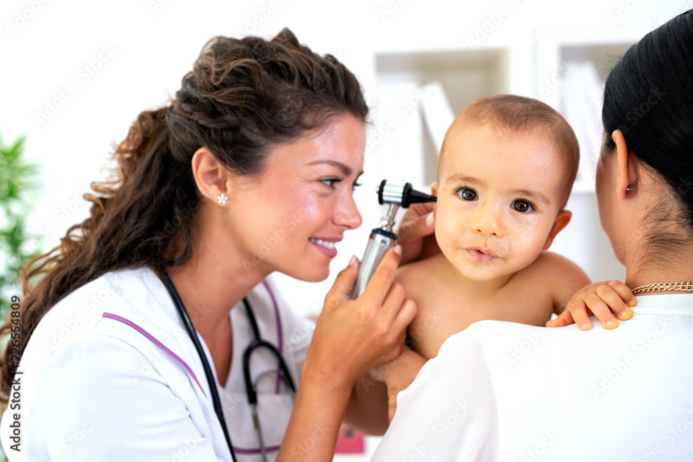 Pediatrician providing healthcare for her baby patient Pediatrician providing healthcare for her baby patient