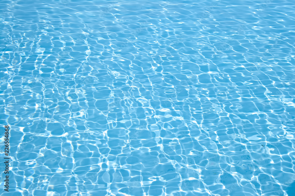 Wonderful crystal light blue clear water of a swimming pool