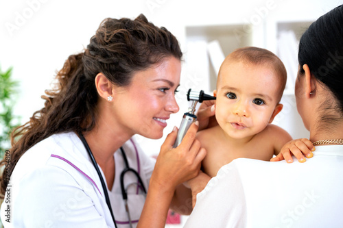 Pediatrician providing healthcare for her baby patient
