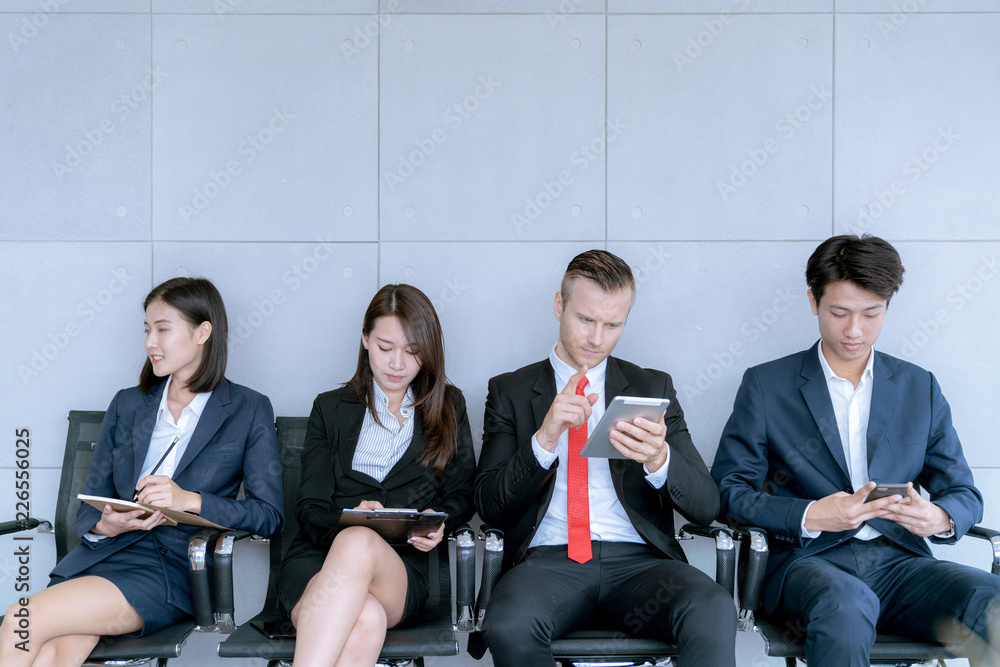 The applicant is sitting to prepare for an interview for a job in a public company in office The applicant is sitting to prepare for an interview for a job in a public company in office