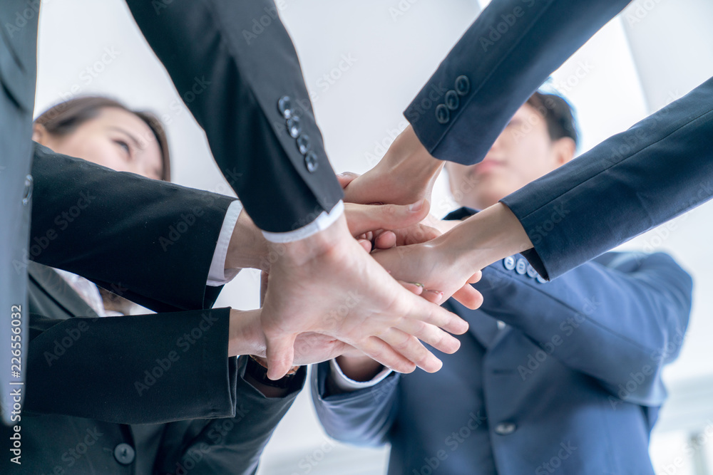 Group of officer teamwork is happy and join hands to celebrate in success Group of officer teamwork is happy and join hands to celebrate in success