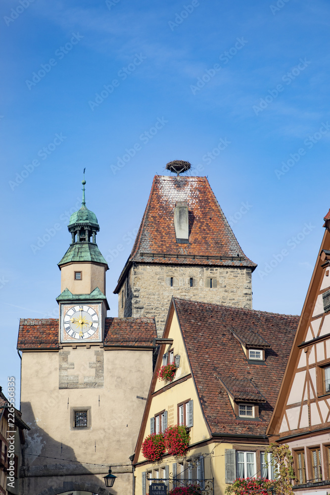town gate in Rothenburg ob der Tauber with stork nest on top