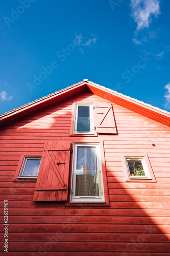 Windows with stutters on wooden building photo