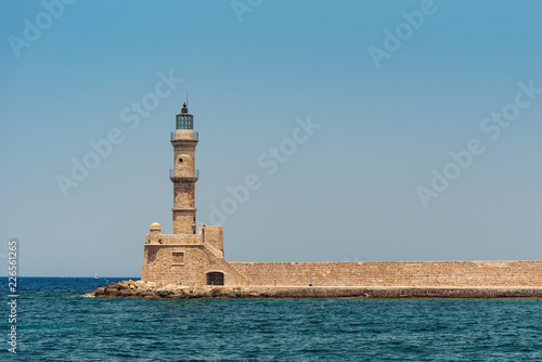 Chania Bay with sea water and a lighthouse on a sunny summer morning, Crete Greece, toned