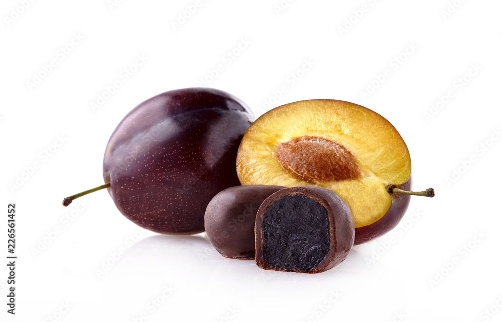 Fototapeta premium Plums with prunes in chocolate on white background.