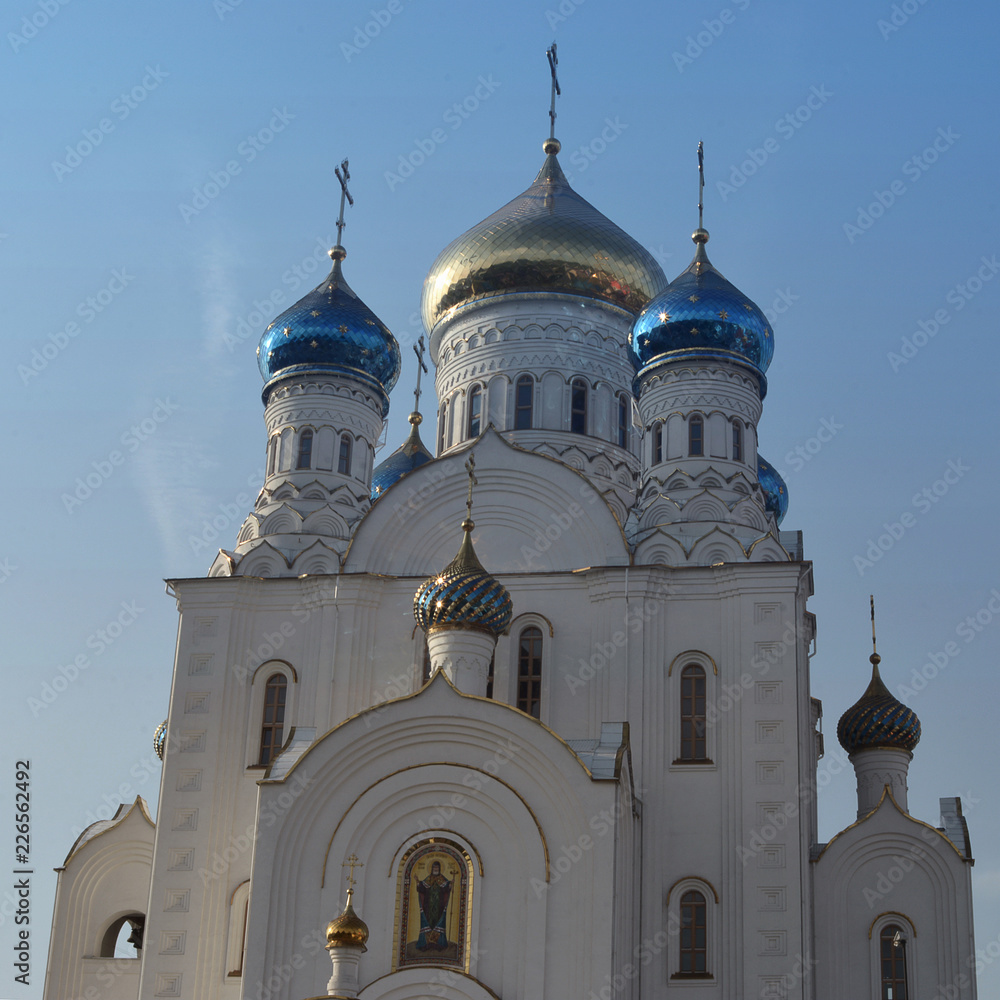 Russian orthodox temple with golden domes. Russian religious architecture.