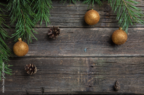 Yellow Christmas balls on wooden background