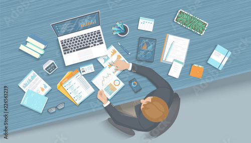 Man working in office at the table. Workplace Desktop Workspace Armchair, business office supplies, laptop, documents, tablet, notepad, folder, envelope, books. Charts, graphics on the screen. Vector