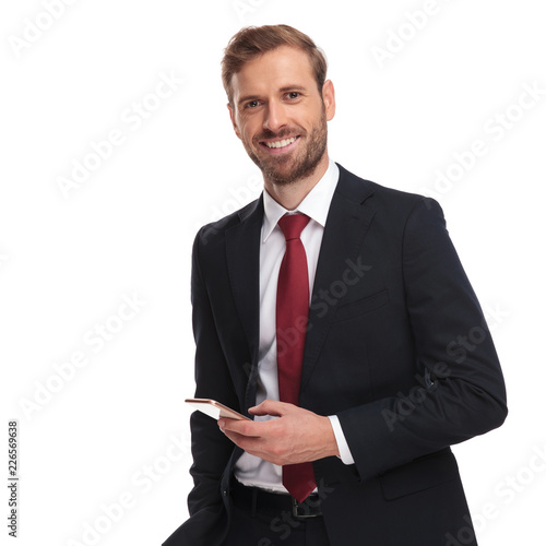 portrait of relaxed attractive businessman texting on the phone
