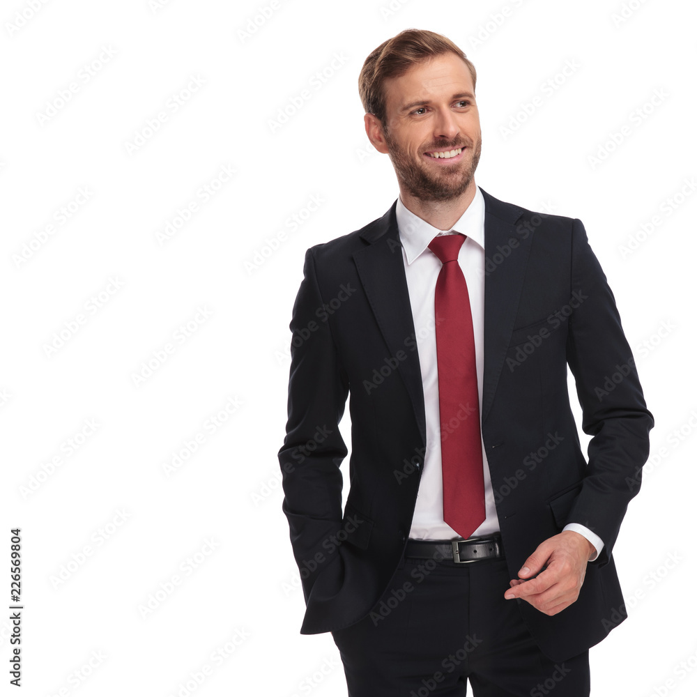 handsome relaxed businessman looks to side handsome relaxed businessman looks to side