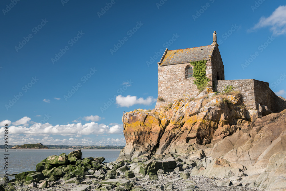 Small chapel on the side of Le Mont Saint Michelle on a sunny day in summer
