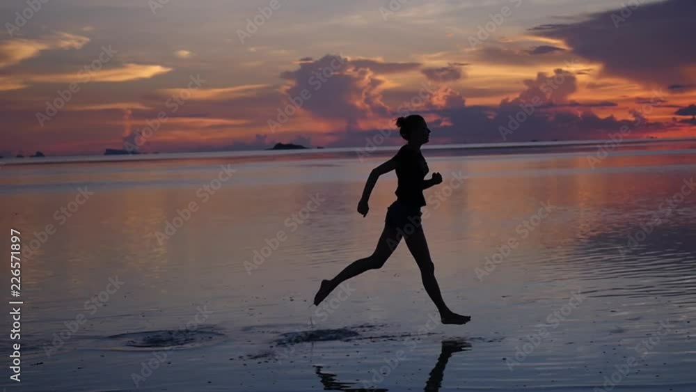 Evening run on the water, the girl athlete on the sea and the magnificent sunset. slow motion, 1920x1080, full hd Evening run on the water, the girl athlete on the sea and the magnificent sunset. slow motion, 1920x1080, full hd