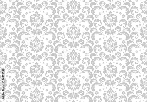 Wallpaper in the style of Baroque. Seamless vector background. White and grey floral ornament. Graphic pattern for fabric, wallpaper, packaging. Ornate Damask flower ornament.