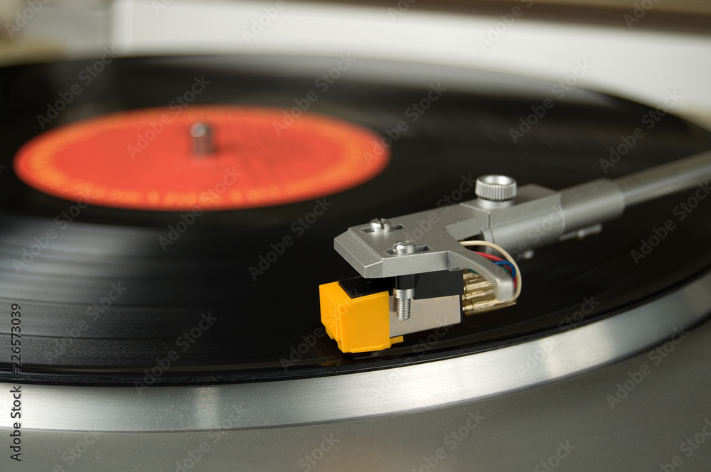 Close View of an Old Turntable with a Vinyl Record Close View of an Old Turntable with a Vinyl Record
