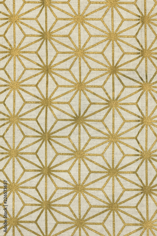 Highly detailed all over background texture of traditional japanese gold and white hemp leaf shaped pattern design textile in synthetic fabric. Highly detailed all over background texture of traditional japanese gold and white hemp leaf shaped pattern design textile in synthetic fabric.