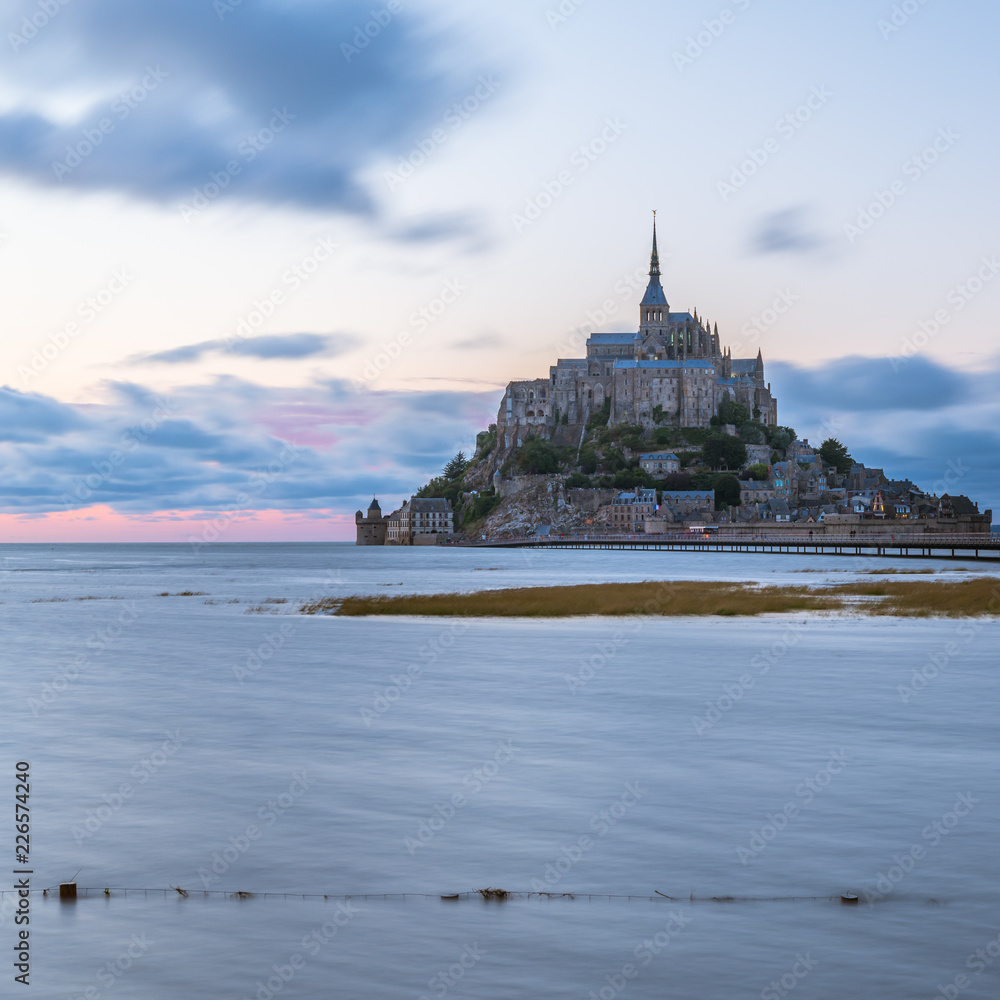 Sunset at Le Mont Saint Michelle in summer at high tide