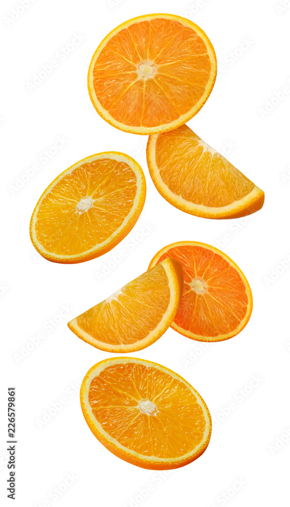 Orange slices in the fall iso isolated on white background. Picture for juice packaging.; Orange slices in the fall iso isolated on white background. Picture for juice packaging.;