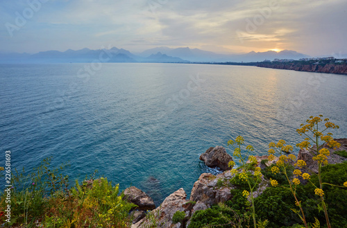 Seascape timelapse of high mountains over clear sunset sky in Antalya, Turkey.