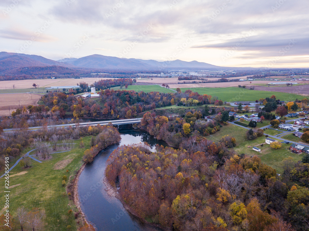 Aerial of the small town of Elkton, Virginia in the Shenandoah Valley with Mountains in the Distance