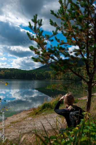 Tourist girl and beautiful autumn nature