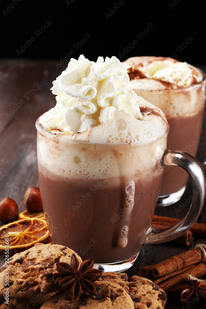 Hot chocolate cocoa with whipped cream on table. Hot chocolate cocoa with whipped cream on table.