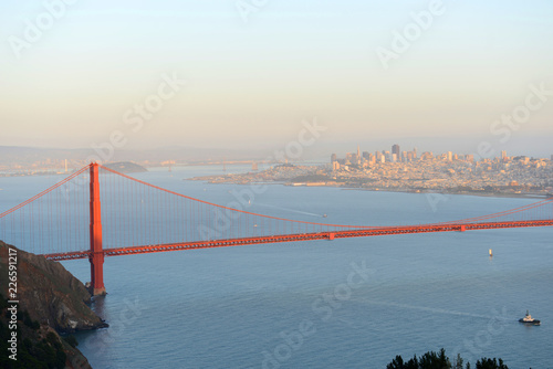 Golden Gate Bridge in dusk, with San Fransisco City at the back ground, San Francisco, California, USA.