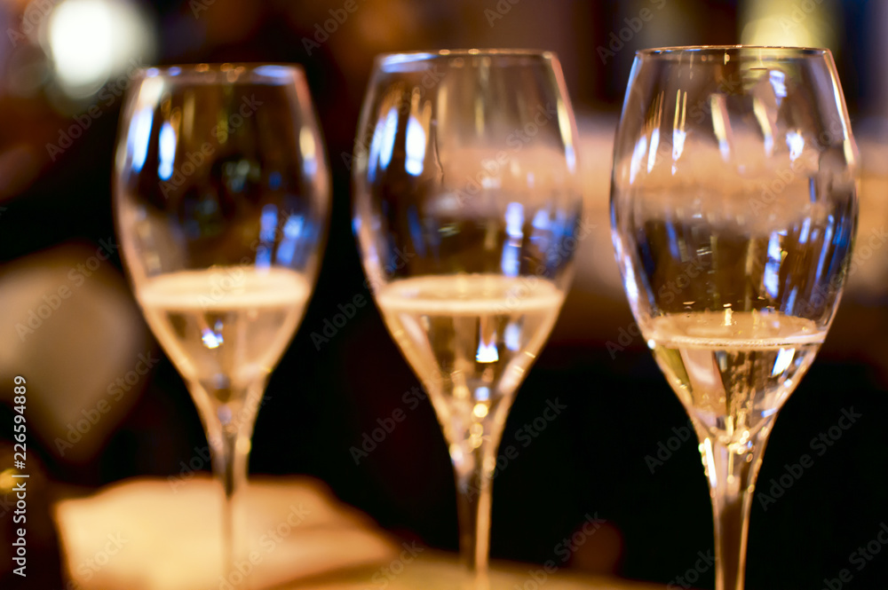 Champagne glasses in tow selective focus Champagne glasses in tow selective focus