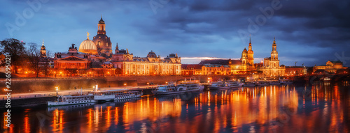 Fantastic colorful sunset in Dresden with dramatic sky, over the Elbe river. view of Cathedral of the Holy Trinity or Hofkirche, Bruehl's Terrace or The Balcony of Europe. Creative image. Germany