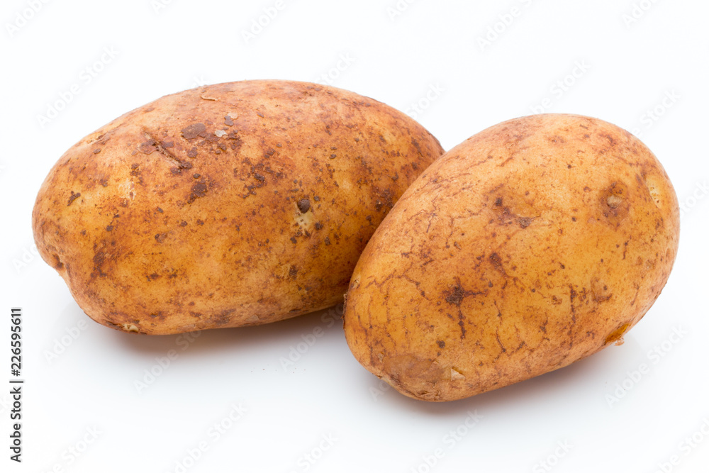 A bio russet potato isolated white background. A bio russet potato isolated white background.
