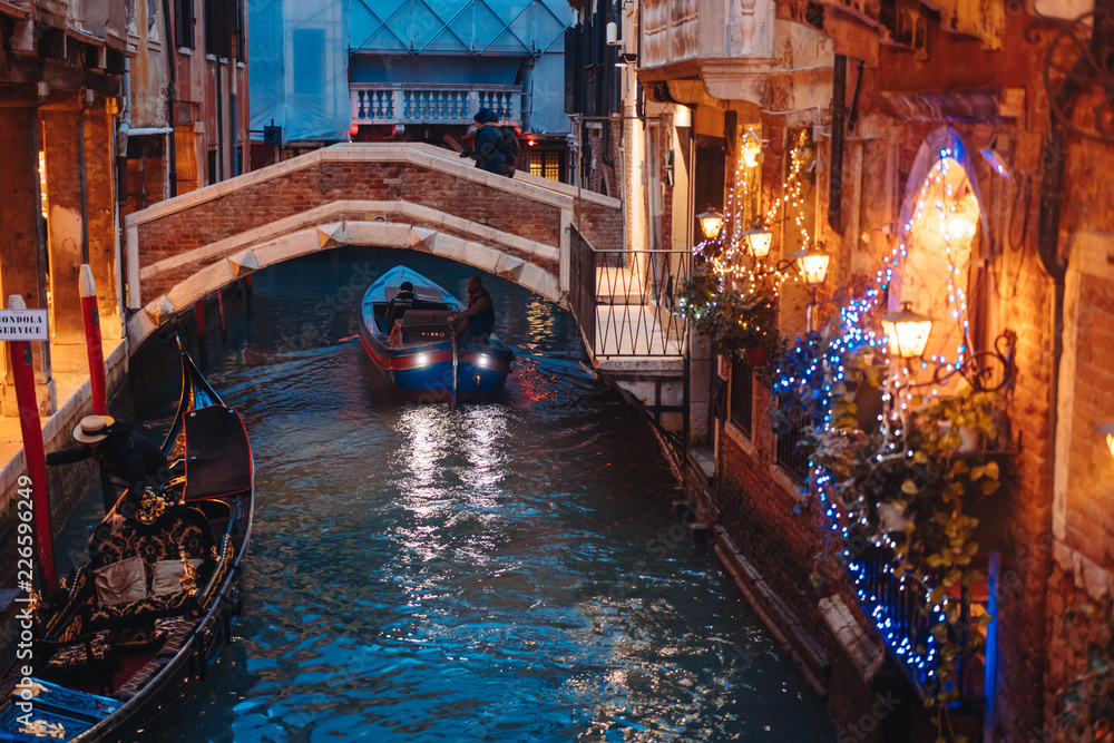 Venice canal late at night with street light illuminating