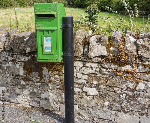 bright green rural post office mail box  on Irish country road  photo