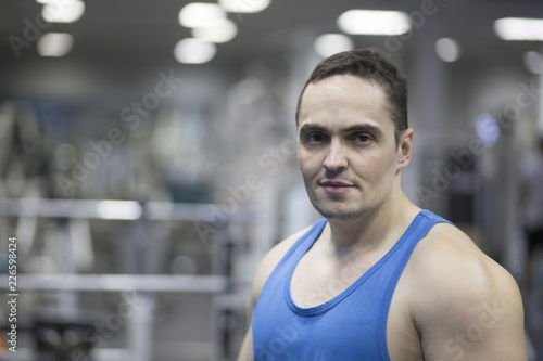 portrait of young man in gym