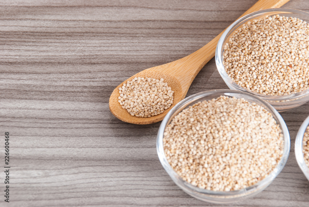 Grains of quinua on wood - Chenopodium quinoa Grains of quinua on wood - Chenopodium quinoa