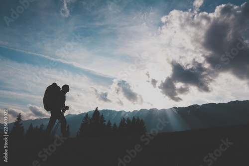 silhouette of a girl on top of mountain