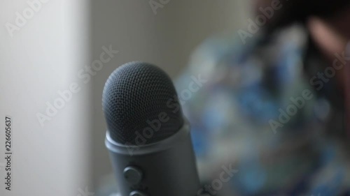 Professional Microphone And Computer Work Station In Modern Office With Slo-Motion Pan Shot