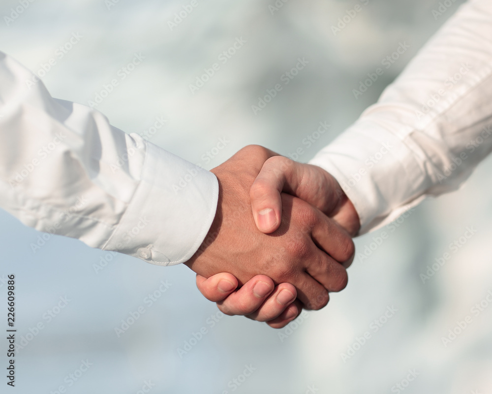 Close-up photo of handshake of two successful businessmen Close-up photo of handshake of two successful businessmen