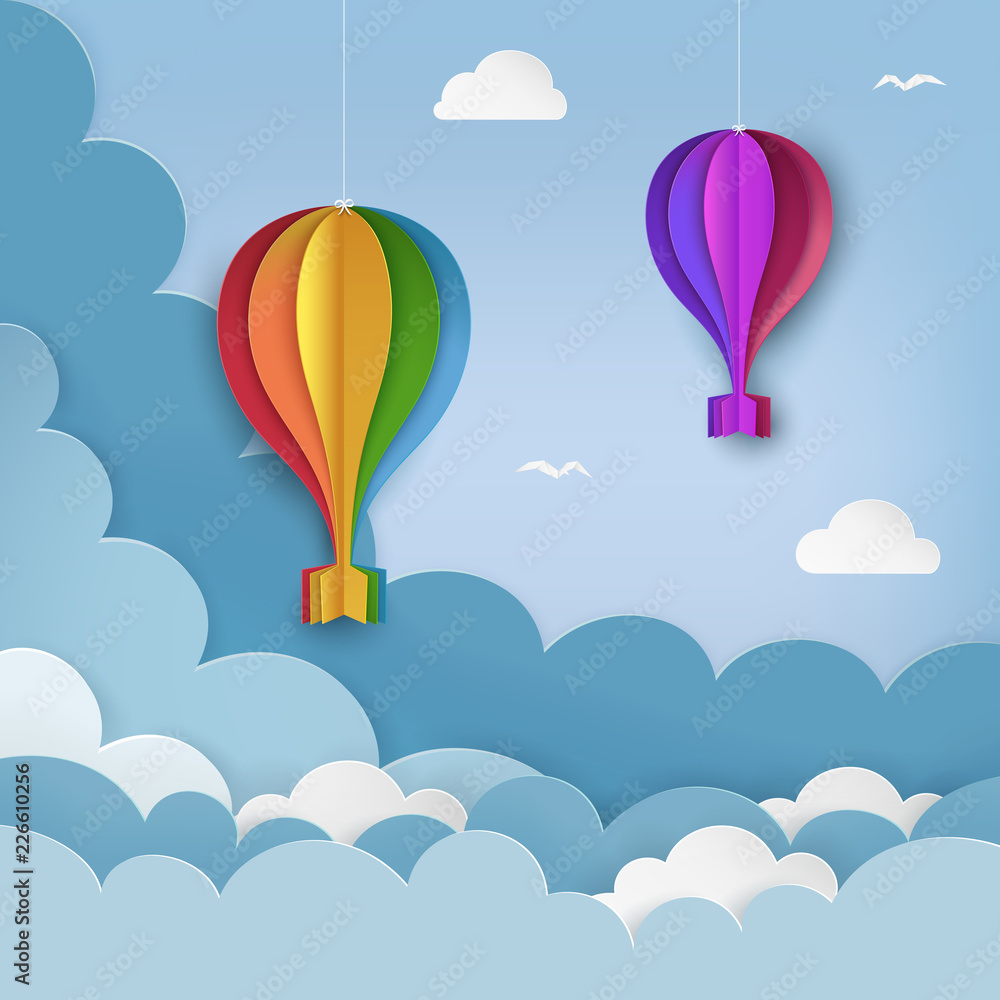 Hanging paper craft hot air balloons, flying birds, clouds on the daytime sky background. Cloudy sky background. Minimal summertime scene. Paper hot air balloon garland with bows. Vector Illustration.