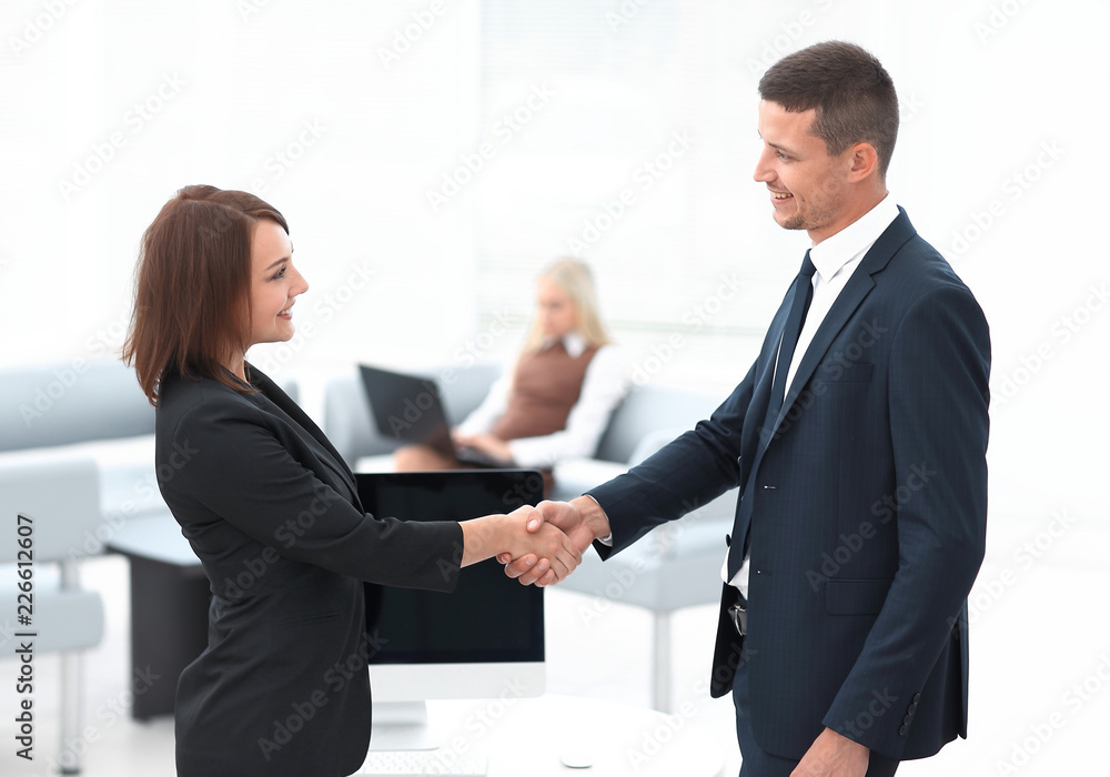 handshake business partners at the negotiating table. handshake business partners at the negotiating table.