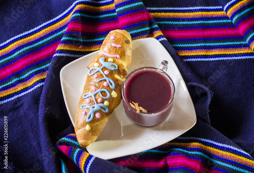 traditional dish and drink Ecuador, called: Colada Morada and bread guaguas