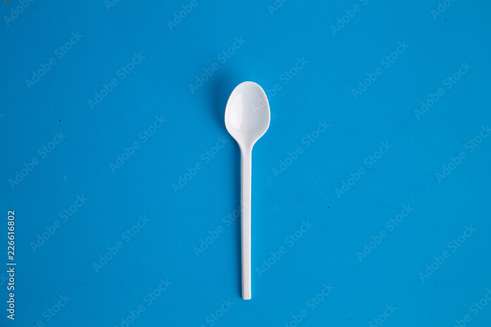 plastic spoon on colorful background plastic spoon on colorful background
